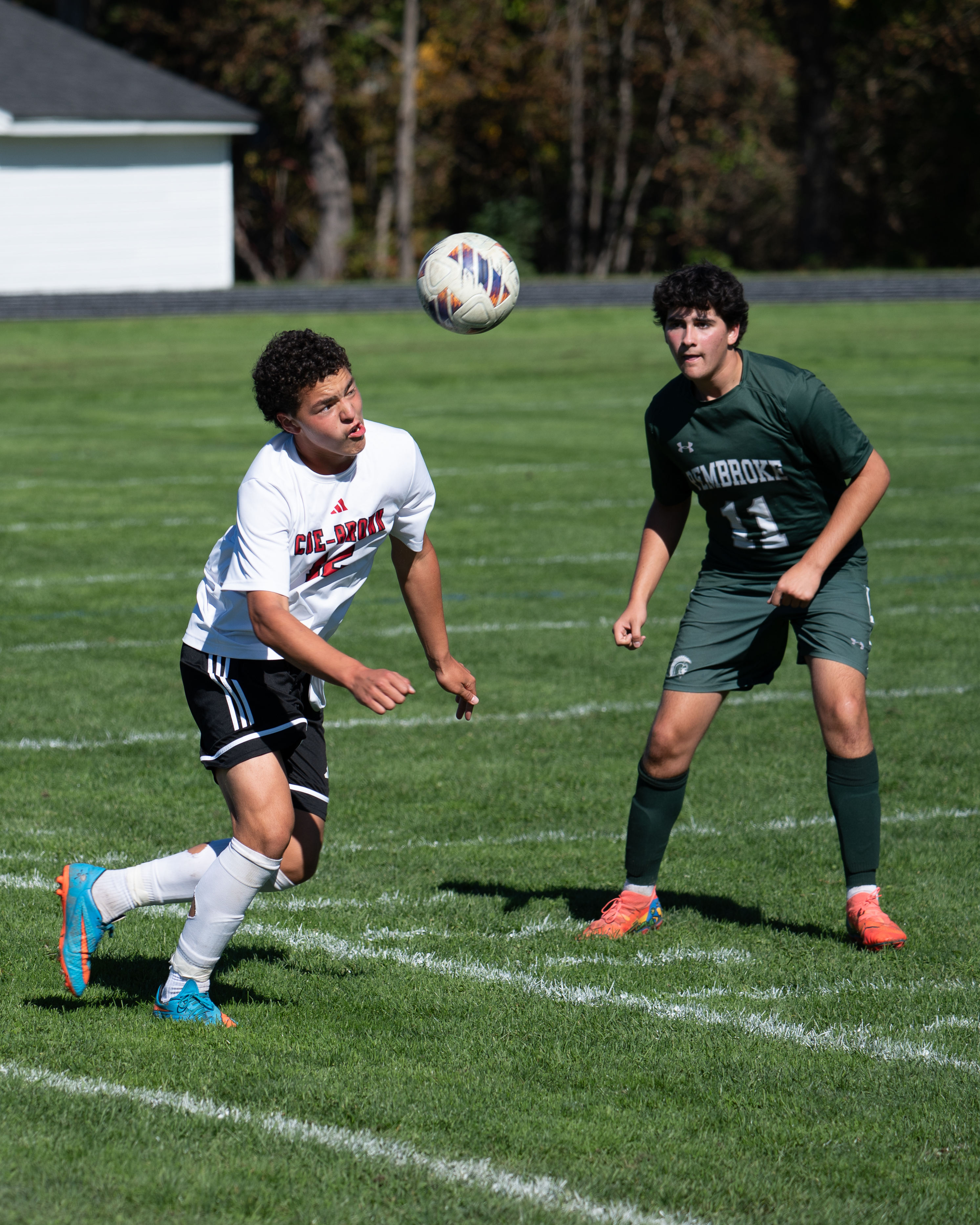 High school athlete mid-play with an intense, wide-eyed game face