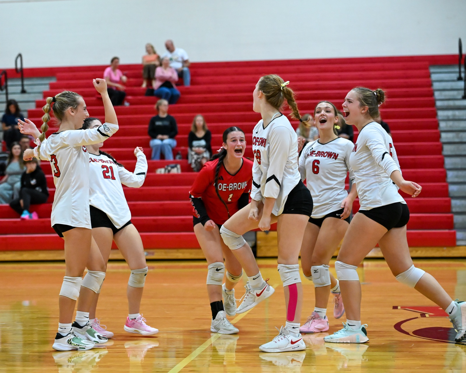 High school teammates celebrating together after a big play