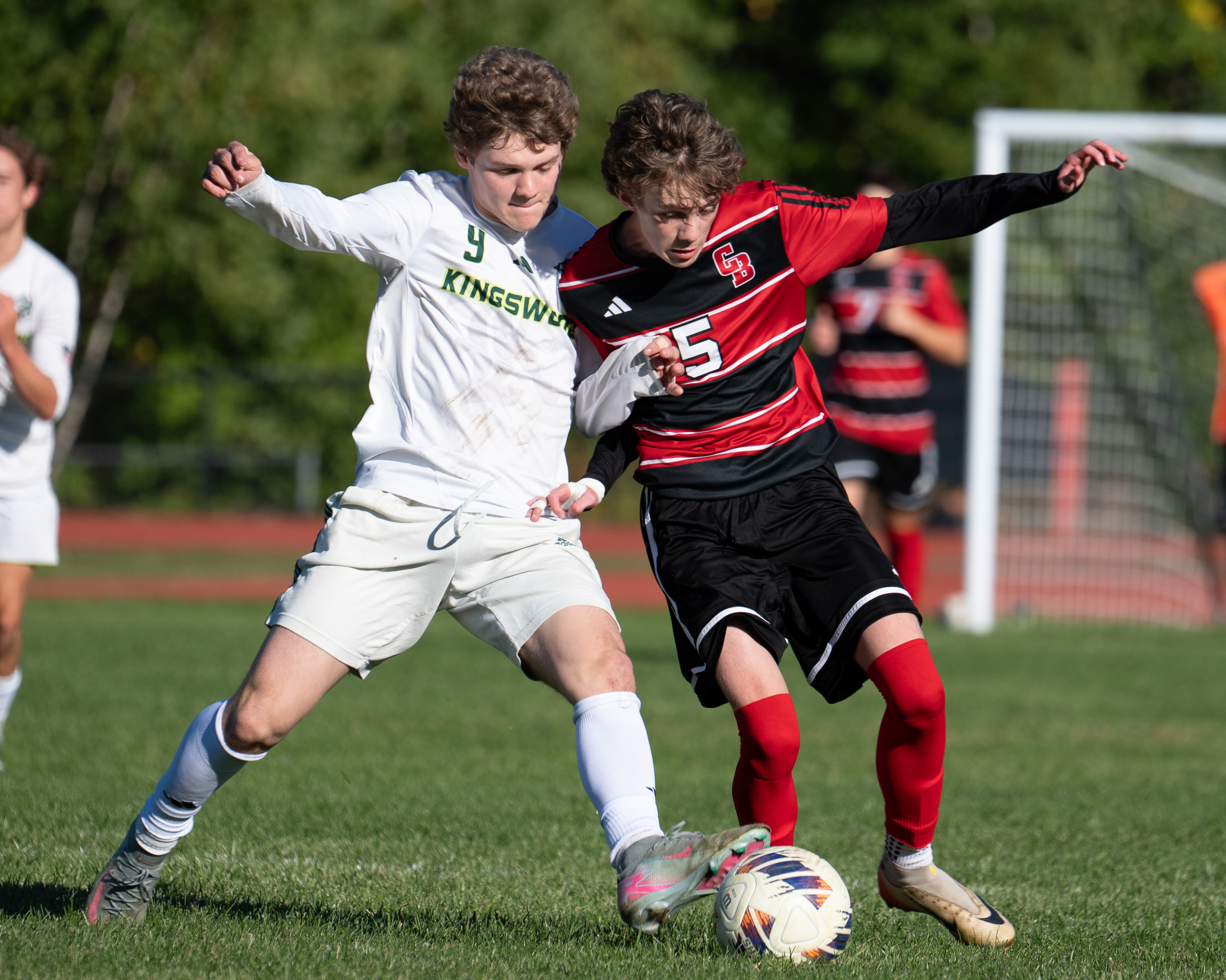 Kingswood and Coe-Brown soccer players battling for the ball