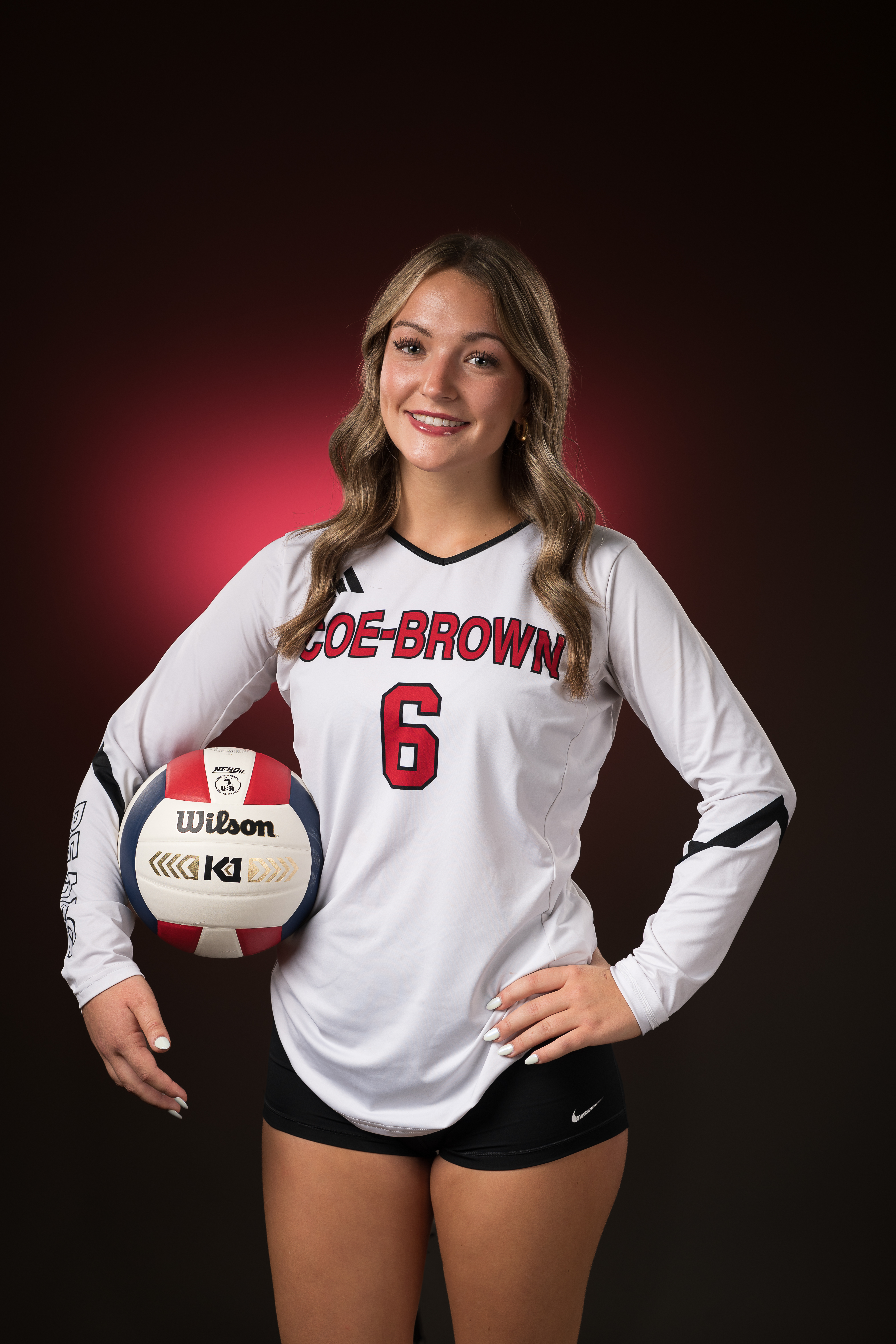 Coe-Brown volleyball player individual portrait with red accent lighting